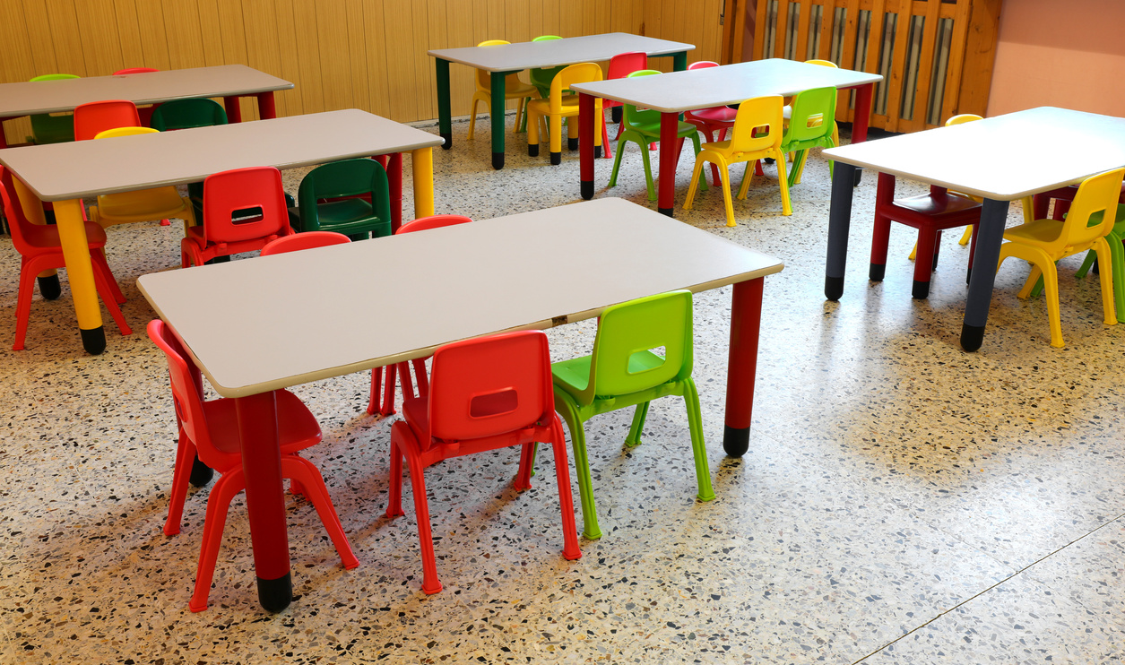 nursery school refectory without children with colorful chairs